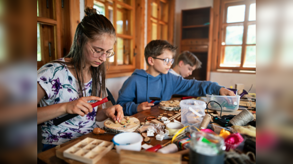 Child enjoying a learning game with their parent